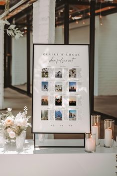 a table topped with candles and pictures next to vases filled with flowers on top of a white table cloth