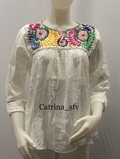 Floral Embroidered Tunic Top For Festival, White Top With Chikankari Embroidery For Festivals, White Chikankari Embroidered Top For Festival, Long Sleeve Blouse With Multicolor Embroidery, Cotton Blouse With Multicolor Embroidered Sleeves, Cotton Blouse With Multicolor Embroidery And Embroidered Sleeves, White Embroidered Tunic Top, Multicolor Long Sleeve Top With Embroidered Hem, Traditional Embroidered Tunic Peasant Top