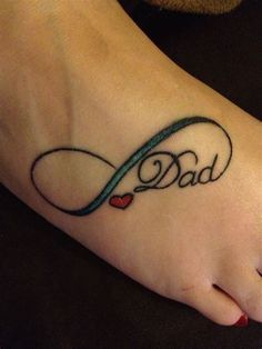 a foot tattoo with the word dad written on it