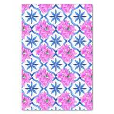 a pink and blue flower pattern on a white background