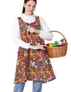 a woman in an apron holding a basket full of fruit and vegetables on a white background