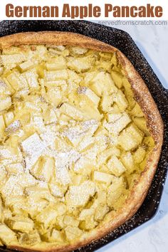 a close up of a pie with powdered sugar on top and the words german apple pancake above it