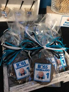 some cookies wrapped in plastic and tied with blue ribbon