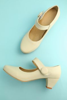 No matter where you are planning to show it off, these 2 inch heels are perfect for completing any professional demure outfit. A cream colored shoe that is understated in the best possible way. Its elegant strap, highlighted with a matching cream button, rounded toe and short heel make this perfect for in the office or dancing the night away. A tasteful shoe sure to highlight your grace and beauty. Shipping You have 7 days to do a return or exchange with any worries: More details Free shipping o Cream Color Shoes, 1950 Heels, Demure Outfit, Dark Green Velvet Dress, Burgundy Bridesmaid Dresses Long, Party Dresses With Sleeves, Sleeved Velvet Dress, Long Sequin Dress, Pointy Heels