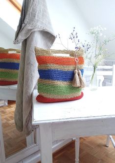 RAFFIA raffia bag summer bag/Ibiza, cheerful colorful stripes beautifully large handmade, crocheted with 2 jute tassels, easy to remove The bag is lined with light, washable fabric and a small inner compartment With handle Long durability of the bag 100% raffia, palm fiber, robust material, very durable, just wipe clean Colorful stripes in dimensions: width approx. 40 cm Height approx. 40 cm Handle length approx. 5 cm in the middle, width 15 cm inside with zipper Solid ground Rafia Bag, Tassels Handmade, Raffia Palm, Hand Lines, Bag Summer, Summer Bag, Raffia Bag, Market Bag, Crochet Bag