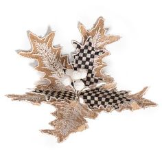 an image of a leaf decoration on a white background with checkered leaves and cotton balls