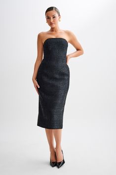 Timeless classic.Presenting the MONET Tweed Strapless Midi Dress, a timeless piece that exudes sophistication and elegance. With its strapless design, this dress showcases your shoulders with graceful allure. Fitted at the waist, it accentuates your figure beautifully, while the straight skirt shape offers a classic silhouette. Complete with a centre back zipper for easy wear and a midi length for a touch of refinement, this dress is crafted from tweed fabrication, adding texture and depth to yo