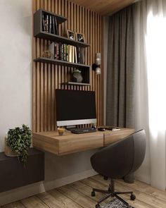 a desk with a computer on it in front of a book shelf and window sill