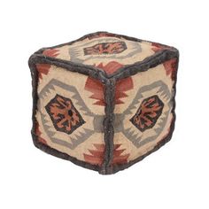 a small square shaped rug with an orange and brown design on it's sides