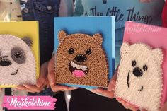 three people holding up small handmade cards with animals on them and panda bear, polar bear