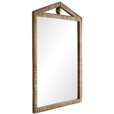 a wooden mirror hanging on the wall with a metal ball at the top and bottom