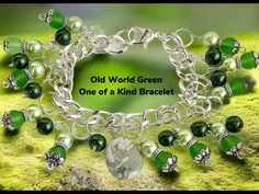 "Our Old World Green beaded bracelet is a one of a kind as only one will be made insuring a treasured memory for you.   The bracelet is a approx 8\" shiny bright silver tone continuous link chain with a large and secure lobster clasp Each glass bead of 3 different colors green is attached with a Silverplated double split ring for added security and beauty. The center is adorned by a polished light green accent stone. The bracelet will come gift boxed at no extra charge Also we are offering to ad Green Beaded Bracelets, Christmas Charms, Colors Green, Green Accents, Split Ring, Handmade Artisan, Adjustable Bracelet, Glass Bead, Link Chain