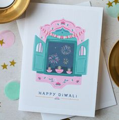 a happy diwali card with fireworks in the window