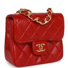 This Vintage Micro Belt Flap Bag is in Red lambskin with gold hardware, signature CC interlocking front snap closure on front flap, a rear half moon pocket, and an interwoven gold plated chain link and red leather handle that can be hooked onto an adjustable interwoven gold plated chain link and red leather waist strap. The interior is lined in Red leather and has no pockets. Collection: 1990Origin: FranceCondition: Vintage; Excellent-Mint - This bag retains its structure and there are slight si Luxury Red Flap Bag With Gold-tone Hardware, Luxury Red Bag With Chain Strap, Luxury Designer Red Flap Bag, Luxury Red Designer Flap Bag, Luxury Red Bags With Snap Closure, Chanel Box, Waist Strap, Sierra Leone, Vintage Chanel