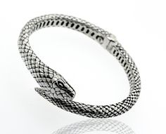 Sterling silver handcrafted designer cuff bracelet with an elegant textured snake design. Material: .925 Silver Finish: Oxidized Adjustable Luxury Snake Bracelets, Adjustable Luxury Snake Bracelet, Luxury Adjustable Snake Bracelets, Luxury Adjustable Snake Bracelet, Adjustable Luxury Snake Jewelry, Slithering Snake, Snake Ring Silver, Snake Bracelet, Snake Design