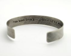 "Oxidized Sterling Silver Personalized 1/2 in wide Cuff Bracelet, Double Sided, Gift for Man, Anniversary, Father's Day Hidden Message, Wedding, Keepsake This beautiful cuff with rustic finish makes a perfect gift for both men and women. It is hand stamped with the text of your choice - I can be names, phrase, song lyrics. It can be stamped on the inside or outside of the bracelet up to 60 characters on either side. If you need a longer quote please contact me for pricing. Pictured cuff has a ox Rustic Silver Bracelets For Gifts, Rustic Silver Bracelet For Gift, Rustic Stamped Cuff Bracelet Gift, Rustic Stamped Bracelets For Gift, Rustic Stamped Bracelets For Gifts, Father's Day Gift Cuff Bangle Bracelet, Father's Day Gift Cuff Bracelet, Custom Engraved Bracelet For Gift, Bangle Cuff Bracelet For Father's Day Gift