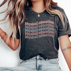 Whether you're looking for a fun and unique gift for a teacher friend or want to treat yourself to something special for the first day of school, this PE Teacher shirt is sure to bring a smile to your face and to your students'. Find more back to school shirts, sweatshirts and gifts for your favorite Physical Education Teacher here: https://www.etsy.com/shop/JaxGraphicTees?search_query=pe All of our adult t-shirts are Bella + Canvas 3001 Unisex shirts. They are a super soft fabric that will quic Casual T-shirt For Back To School Gift, School Spirit T-shirt With Letter Print As Gift, Casual School Tops With Custom Text, Casual Tops With Custom Text For School, Casual T-shirt With Custom Text For School, Gym Teacher Gifts, Pe Teacher Gifts, Gym Teacher, Pe Teacher