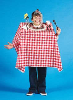 a woman dressed in a red and white checkered ponchy