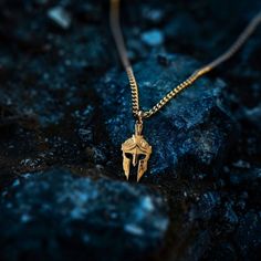 Channel the warrior spirit with our gold Spartan helmet pendant, meticulously crafted in the USA. Symbolizing strength, honor, and valor, these pieces are designed for those who embody the fearless spirit of a Spartan. PENDANT INFORMATIONThis pendant is made of real, solid gold.• Made in USA• Material: 14k or 18k solid gold• Finish: polished• Height: 1.5" (38 mm) | *includes the small circle, bail dimensions not included• Width: 0.8" (19,5 mm)• Pendant weight: approx. 6 grams (14k)• Bail: fits u Warrior Style Gold Necklaces As Gift, Engraved Warrior Style Pendant Jewelry, Warrior Style Engraved Pendant Jewelry, Warrior Style Engraved Sterling Silver Jewelry, Warrior Helmet, Greek Warrior, Phoenix Pendant, Spartan Helmet, Inner Warrior