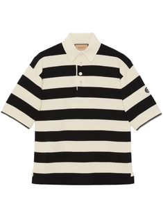 This exquisite knit cotton polo exudes a sense of luxury and style that is unparalleled. The ivory and black striped design is both timeless and fashion-forward, making it a versatile piece for any wardrobe. But what truly sets this polo apart is its detachable zipped sleeves, offering you the flexibility to transform your look with ease. Complete with a pointed collar, front buttoned placket, and the iconic GG patch on the left sleeve, this polo is a true statement of sophistication. Whether yo Gucci Polo Shirt, Rugby Design, Black Color Combination, Removable Sleeves, Detachable Sleeves, Pattern Logo, Knit Polo, Striped Polo Shirt, Leather Cap