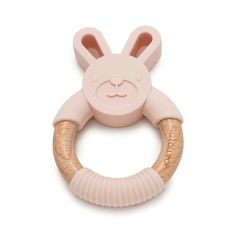 the pink bunny teethpick is attached to a wooden ring