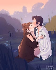 a man and woman are kissing in the grass