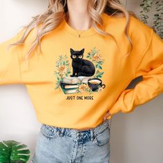 Cozy 'Just One More Cat Mama Sweatshirt' with trendy design and retro librarian charm. Perfect for college, garden reading, or alone time. Ideal gift for book lovers and reading teachers. #CatMama #BookLover #CozyStyle #VSCOFashion Reading Teacher Gifts, Vsco Shirts, Comfy Crewneck, Cat Mama, Librarian Shirt, Great Graduation Gifts, Grand Daughter, Retro Glamour