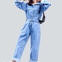 Slay the streets in style with our 2023 Spring Women's Denim Overall! This statement piece is sure to turn heads with its eye-catching free fit and buttoned closure. Get ready to make a statement with its stunning color palette and streetwear style flair.Why It's the Epitome of City ChicThis is one denim overall that's anything but ordinary. With its loose silhouette and bright colors. this overall is the perfect way to up your edgy style game.Features That Make It Pop: Denim Dominance: Nothing Trendy Relaxed Fit Jeans With Buttons, Denim Blue Button-up Jeans For Streetwear, Casual High Rise Denim Jumpsuit For Fall, Fall Cotton Denim Button-up Jumpsuit, Spring Button-up Utility Jeans, Trendy Long Sleeve Denim Jumpsuit In Medium Wash, Spring Medium Wash Overalls With Button Closure, Relaxed Fit Denim Blue Jumpsuit With Buttons, Trendy Long Sleeve Medium Wash Denim Jumpsuit