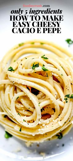 a white plate topped with pasta and parsley