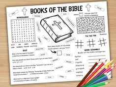 the book of the bible coloring page with pencils and crayons next to it