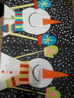 two snowmen made out of construction paper