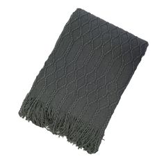 a gray blanket with fringes on it