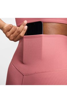 Lightweight InfinaSoft fabric enhances the smooth, freeing feeling of softly ribbed leggings that are ideal for workouts, hangouts and everyday wear. 25" inseam; 8" leg opening; 10 1/2" front rise; 13" back rise (size Medium) Pull-on style Back drop-in pocket Dri-FIT moisture-wicking technology Lined gusset 77% nylon, 23% spandex Machine wash, line dry Imported Nike High Stretch Bottoms For Pilates, Nike Workout Bottoms With Ribbed Waistband, Nike Stretch Yoga Pants For Pilates, Nike Stretch Bottoms For Yoga, Nike Compressive Bottoms For Yoga, Nike Yoga Pants For Yoga, Stretch Nike Yoga Pants, Nike Stretch Leggings For Functional Wear, Functional Nike Stretch Leggings