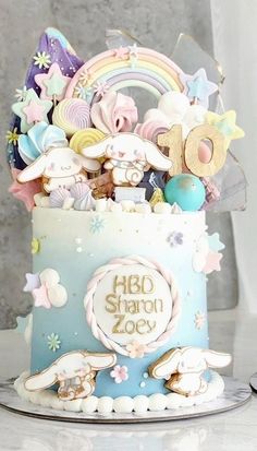 there is a cake decorated with toys and decorations on the top tier, as well as an inscription that says hello shard zoo