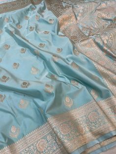 This is a very beautiful high quality mashru silk saree . All over zari motifs design with border . Saree length - 5.5 mtr. Blouse - 1 mtr. Dry clean only . Please note - color may be vary a little due to sunlight and photography . Please message us after purchasing in case you want fall and Pico done it not . No extra charges for fall and Pico but inform us . Blouse stitching is also available . Pastel Blue Saree, Light Blue Saree, Butta Design, Silk Saree Wedding, Motive Design, Wedding Wear Saree, Motifs Design, Blouse Stitching, Design Saree