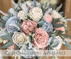 a bridal bouquet with pink, grey and white flowers