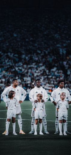 a group of soccer players standing next to each other