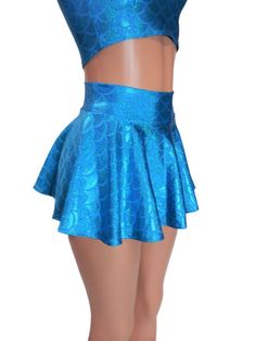 "Turquoise , Big round Shimmering mermaid scale print spandex skater skirt 12\" shown on mannequin.High waist skirt can be worn lower or higher most skirts allow you to place the waistline where it suits you, on your particular body shape and personal desire! this fun flirty skirt is a full circle design and can be ordered in lengths of 10 inch, 12 inch, 15 inch and 19 inch- if you need a longer length contact me for a quote. Any of my items can be made in any spandex fabric, also any item can b Fitted Light Blue Skirt With Ruffles, Light Blue Fitted Skirt With Ruffles, Blue Stretch Ruffle Skort, Blue Ruffled Stretch Skort, Blue Fitted Skirt With Ruffles, Fitted Blue Skirt With Ruffles, Blue Stretch Mermaid Dress With Fishtail, Stretch Mermaid Skirt For Party, Blue Stretch Mermaid Dress