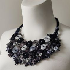 I created this statement necklace as an oversized black collar necklace beaded with graphite color glass beads. The monochromatic gray colors bib necklace looks very extravagant and urban. It is the perfect gift for a woman who loves original and exclusive jewelry. Personalization in colors and shapes is available if you place a custom order for a similar necklace. ➽ Size Deco detail 7 1/2"x 8" ( 19 x 20 cm ), total length is 20" (50 cm). If you are not exactly sure about the length needed for t Unique Black Bib Necklace As A Gift, Unique Handmade Black Bib Necklaces, Unique Handmade Black Bib Necklace, Oversized Necklace, Fiber Art Jewelry, Statement Collar, Statement Collar Necklace, Gift For Woman, Necklace Beaded