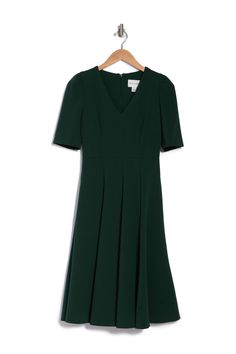 A figure flattering fit and flare silhouette makes this elbow sleeve dress a stylish addition to your wardrobe, finished off with a sleek V-neckline. Fit: this style fits true to size. V-neck. Elbow length sleeves. Hidden back zip closure. Solid. Woven construction. Approx. 43" length (size 2). Imported Green Fitted V-neck Dress With Short Sleeves, Fitted Green V-neck Dress For Work, Formal Green A-line V-neck Dress, V-neck Fit And Flare Midi Dress For Work, V-neck Fit And Flare Dress With Back Zipper, Green Fitted V-neck Workwear Dress, Green Fitted V-neck Dress For Work, Elegant Green Short Sleeve V-neck Dress, Elegant Green V-neck Dress With Short Sleeves