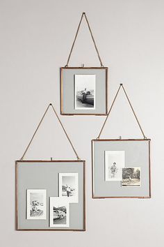 three frames hanging on the wall with pictures