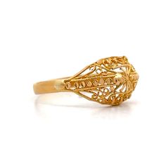 This exquisite modern filigree ring, crafted from 21 karat yellow gold, features an intricate design that highlights its rich, vibrant hue. The detailed filigree work is meticulously fashioned into delicate swirls and curves, creating a lace-like effect that captures and reflects light beautifully. This unique piece stands out whether worn alone or paired with other pieces, adding an artistic and sophisticated look to any ensemble. Elegant 22k Gold Engraved Ring, Luxury Oval Filigree Ring With Intricate Design, Luxury Oval Engraved Filigree Ring, Elegant Gold Filigree Ring, Ornate Gold Engraved Ring With Filigree, Ornate 14k Gold Engraved Ring With Intricate Design, Traditional Gold Filigree Ring With Intricate Design, Formal 22k Gold Filigree Ring, Ornate Gold Engraved Ring With Intricate Design