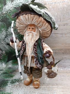 an old fashioned gnome holding a stick and wearing a hat with leaves on it's head