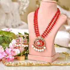 Elevate your style with our Mughal masterpiece - where heritage meets modern elegance! Crafted with precision and elegance, this set captures the opulence of Mughal aesthetics, combining vibrant ruby beads and sparkling CZ stones along with intricately designed mala accompanied by dangling pearls, this set epitomizes grace and sophistication, making it a statement piece for any occasion. The set includes a mala and a pair of earrings. Gold-plated on high-quality brass as base metal. Made by orde Red Jeweled Kundan Necklace Gift, Elegant Red Kundan Necklace, Diwali Ruby Kundan Necklace, Red Kundan Necklace With Gemstone, Bohemian Red Kundan Necklace, Heritage Jewellery, Ruby Beads, Waist Chain, Head Accessories