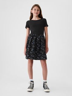 Soft cotton skater dress.  Crewneck.  Short sleeves.  Certain styles have allover prints at the skirt.  This product was made in a factory that invests in gender equality and women’s empowerment.  Through RISE Reimagining Industry to Support Equality) and Gap Inc. ’s program P. A. C. E.  Personal Advancement & Career Enhancement), we support people who make our clothes to build the skills, knowledge, confidence, and resilience needed to advance in work and life.  Learn more here.  Fit and flare Casual Cotton Fit And Flare Dress, Casual Cotton Fit And Flare Mini Dress, Casual Cotton Twirl Dress With Short Sleeves, Casual Cotton Fitted Twirl Dress, Casual Short Sleeve Mini Dress By Gap, Gap Black Mini Dress For Spring, Spring Black Mini Dress By Gap, Casual Cotton Mini Dress By Gap, Gap Fitted Mini Dress