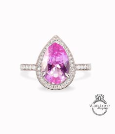 Pink Sapphire Diamond 14kt Gold Diamond Art Deco Unique Pear Halo Milgrain Ring vintage wedding Unique Bridal Anniversary ring solid gold This Ring will be created with your Center gem size of choice. Customize both the center gem size & accent gems to create your own unique look. The ultimate accessory for any Big Day or everyday wear!! Makes the perfect gift for that special someone in your life. Sure to be treasured for a lifetime! Looking for something in particular/custom? Please ask for de Classic Pink Sapphire Ring With Halo Setting, Classic Pink Sapphire Diamond Wedding Ring, Anniversary Pink Sapphire Ring With Halo Design, Pear-shaped Diamond Halo Ring, Pear-shaped Halo Ring Gift, Pear-shaped Halo Diamond Ring, Pear-shaped Sapphire Ring With Center Stone, Halo Teardrop Diamond Ring For Anniversary, Teardrop Halo Diamond Ring For Anniversary