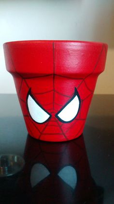 a spiderman planter sitting on top of a table