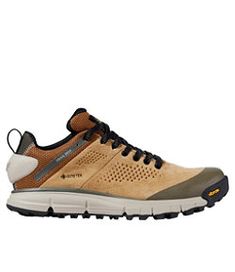 the men's shoe is tan and brown with black laces on the outs