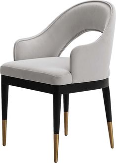 a white and black chair with gold legs