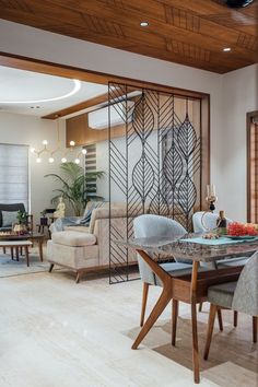 the dining room table is surrounded by chairs and tables with glass doors on each side